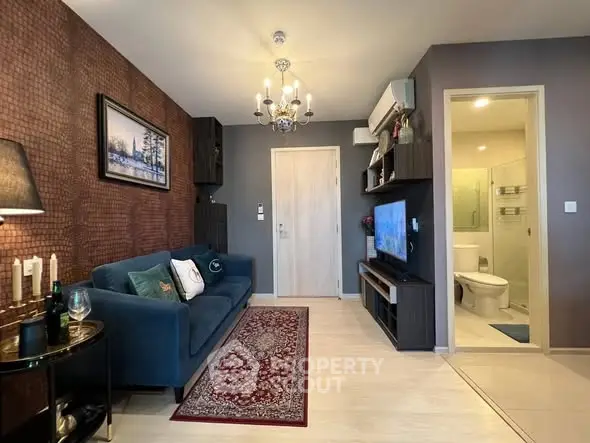 Stylish living room with elegant decor and modern amenities in a cozy apartment.