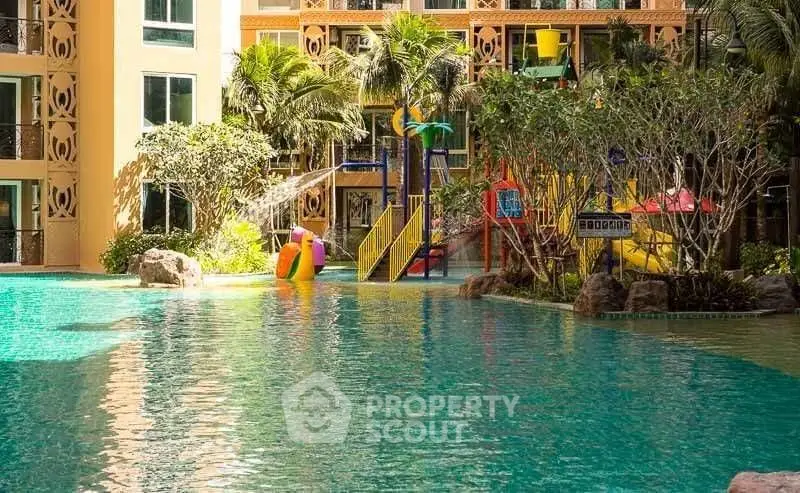Luxurious apartment complex with stunning pool and vibrant playground area.