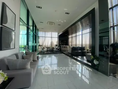 Luxurious modern living room with floor-to-ceiling windows and elegant decor