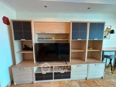 Modern living room with stylish entertainment center and flat-screen TV
