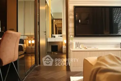 Luxurious modern living room with stylish decor and large TV