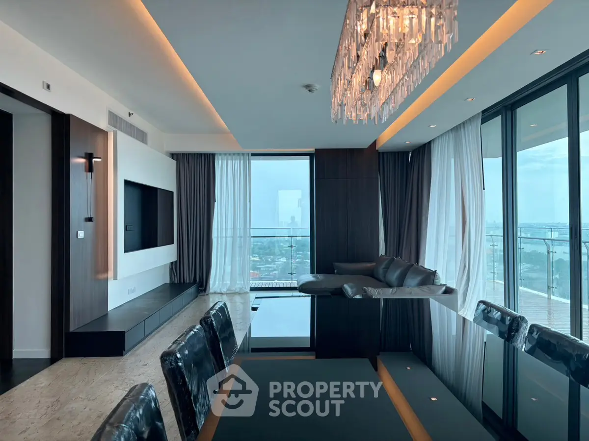 Luxurious modern living room with panoramic city view and elegant chandelier