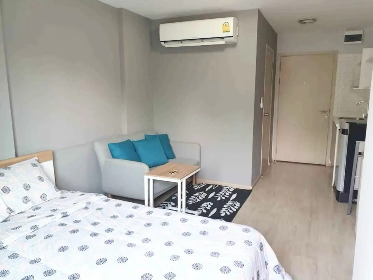 Cozy studio apartment with modern decor and air conditioning