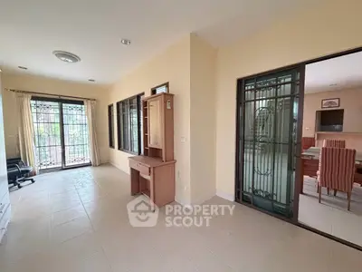 Spacious living area with natural light and elegant dining space, perfect for family gatherings.