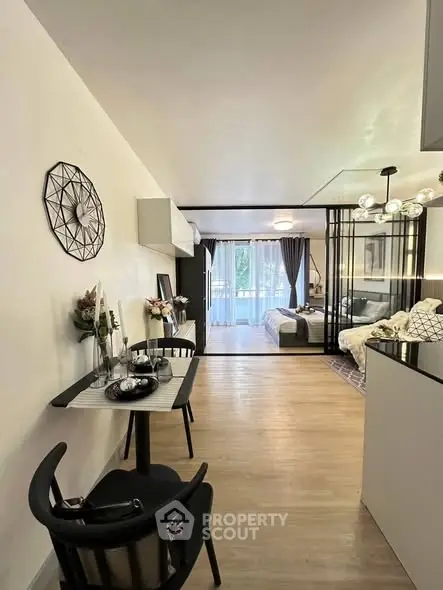 Modern open-plan living space with stylish decor and natural light