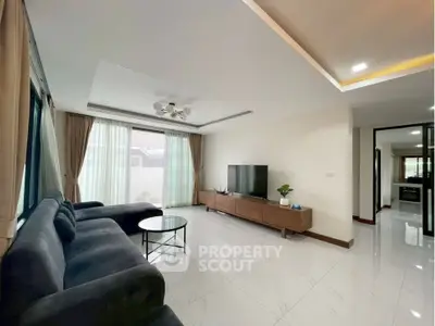 Spacious modern living room with sleek furniture and natural light