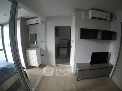 Modern bedroom with mirrored closet and air conditioning in stylish apartment