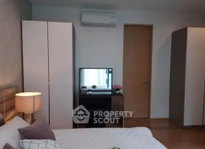 Modern bedroom with stylish furniture and air conditioning, perfect for comfort and relaxation.