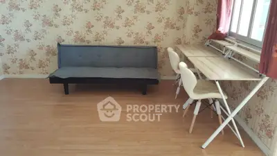 Charming living room with floral wallpaper and modern furniture