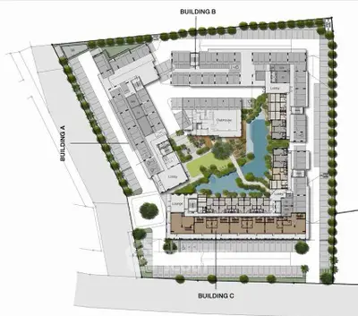 Detailed schematic plan of a modern residential complex with lush central garden.