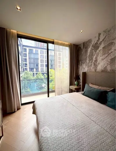 Luxurious bedroom with stunning balcony view in modern apartment