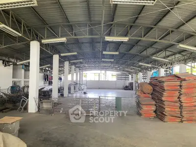 Spacious industrial warehouse with high ceilings and ample storage space.