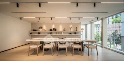 Modern dining area with sleek design and large windows offering city views