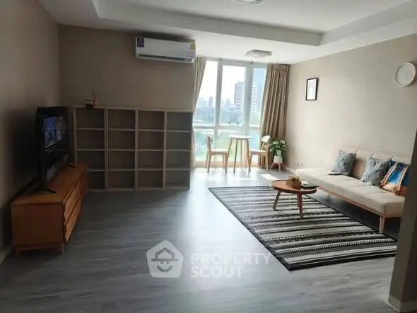 Spacious living room with modern decor and city view