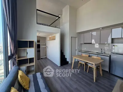 Modern loft apartment with open kitchen and mezzanine in city view