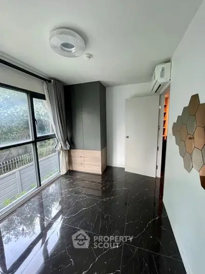 Modern empty room with marble flooring and large window view