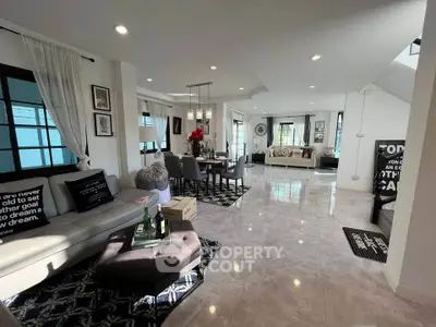 Spacious modern living room with elegant decor and ample natural light