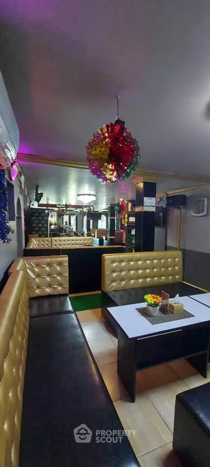 Stylish lounge area with modern seating and vibrant decor, perfect for entertaining guests.