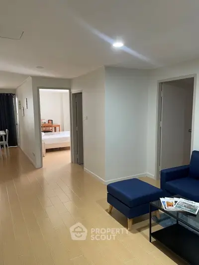 Spacious modern apartment interior with open layout and stylish furniture.