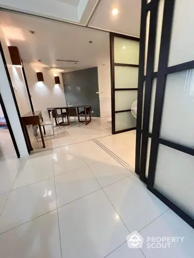 Modern dining area with sleek design and ample natural light