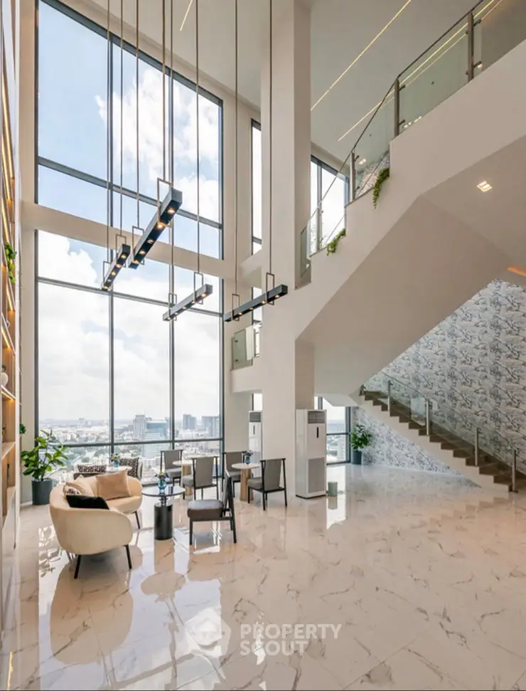 Luxurious high-ceiling living room with stunning city view and modern decor