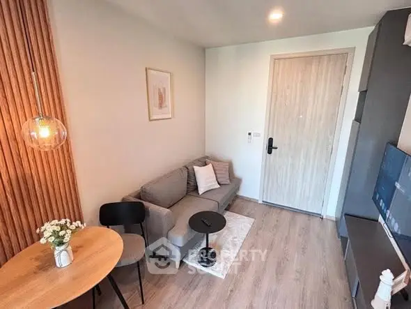 Modern cozy living room with stylish decor and wooden flooring, perfect for urban living.