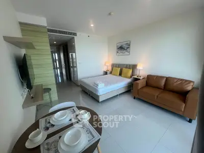 Modern studio apartment with cozy living area and stylish decor