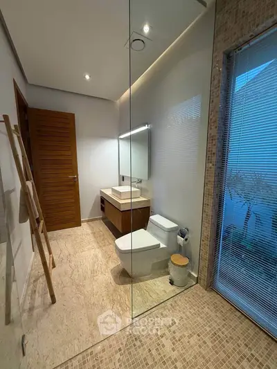 Luxurious modern bathroom with glass shower and elegant fixtures