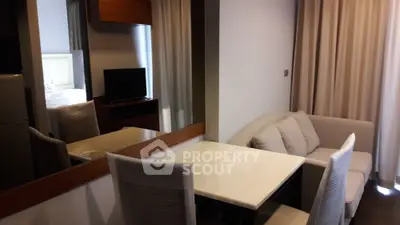 Modern apartment interior with cozy living area and dining table