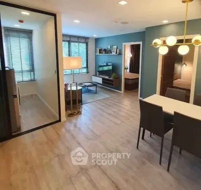 Modern open-plan living room with dining area and stylish decor
