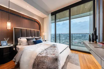 Luxurious bedroom with stunning city view and elegant decor
