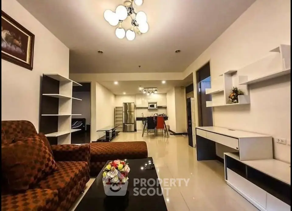 Spacious modern living room with open kitchen layout and stylish decor