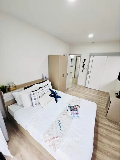 Modern bedroom with stylish decor and ample natural light