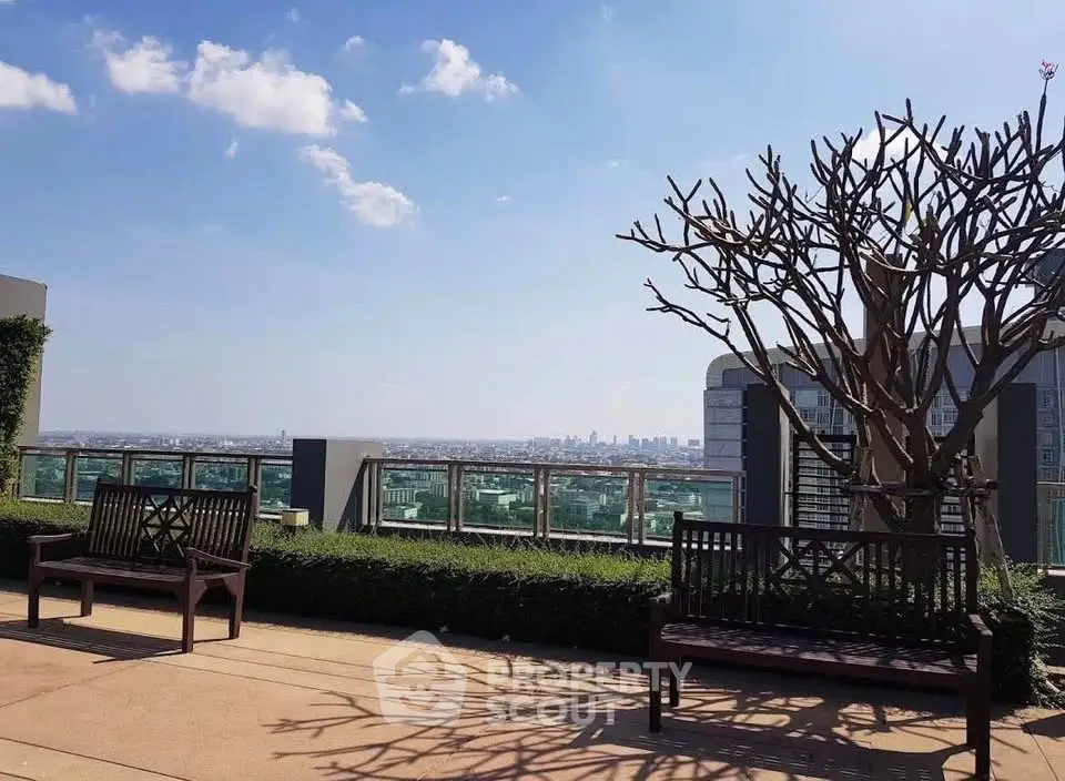 Stunning rooftop view with cityscape and elegant seating area, perfect for relaxation and entertainment.