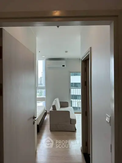 Modern apartment interior with cozy living room and natural light.