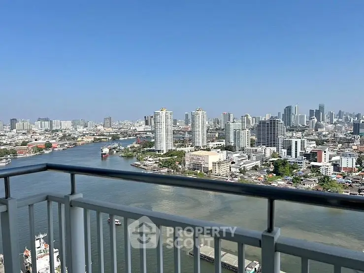 Stunning cityscape view from high-rise balcony overlooking river and skyline