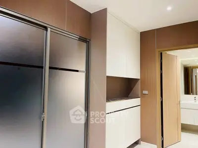 Modern bathroom with sleek design and frosted glass door