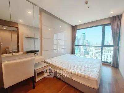 Modern bedroom with city view, featuring sleek design and ample natural light.