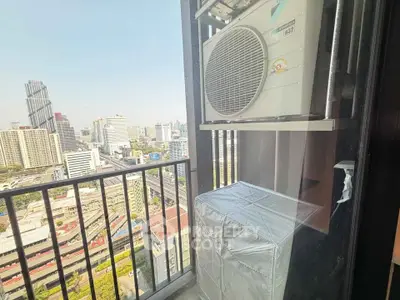 Stunning city view from a modern balcony with air conditioning unit, perfect for urban living.