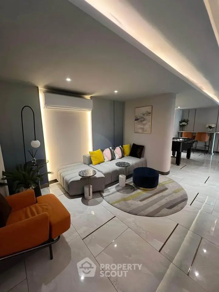 Modern living room with stylish furniture and elegant lighting, perfect for contemporary urban living.