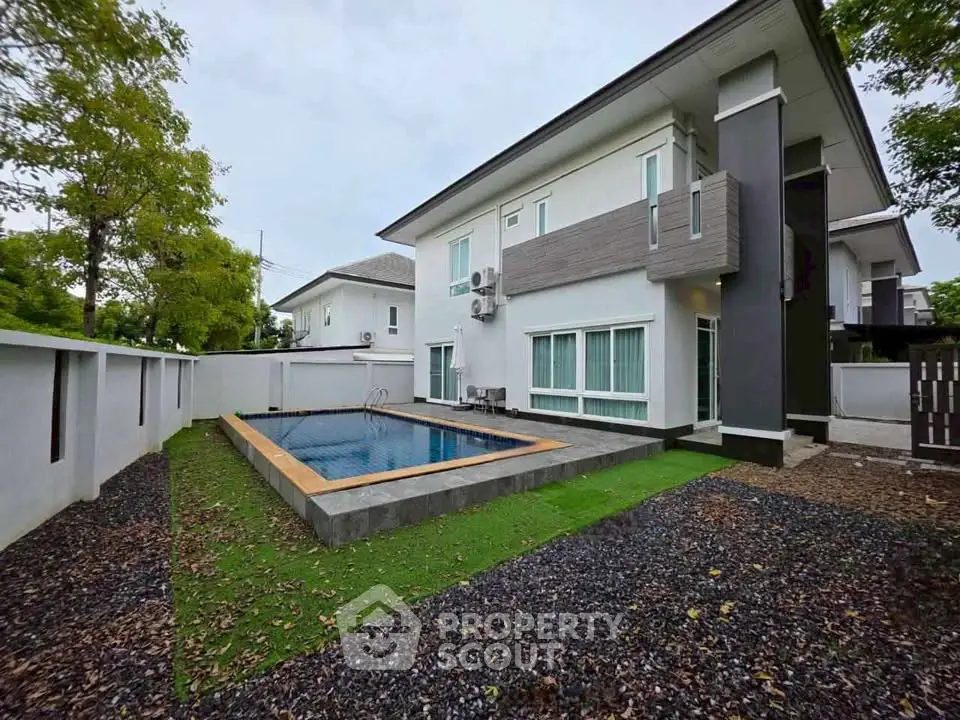 Modern two-story house with private pool and landscaped garden