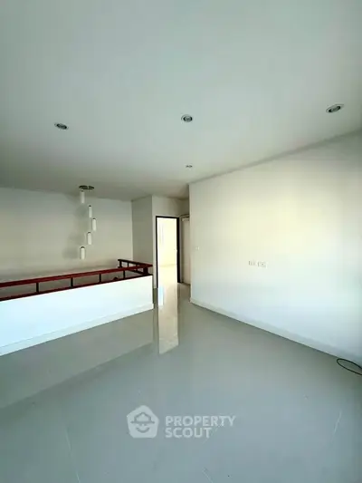 Spacious modern interior with sleek design and ample natural light, perfect for contemporary living.