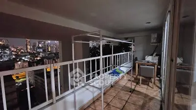 Spacious balcony with stunning city skyline view at night