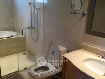 Modern bathroom with glass shower and sleek fixtures