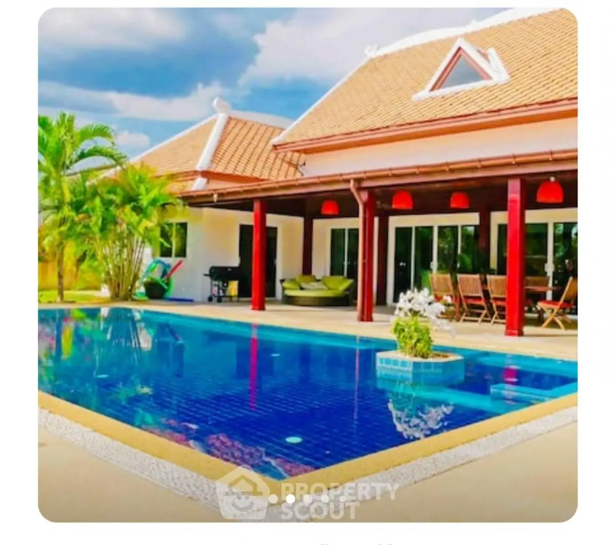 Luxurious villa with private pool and spacious patio in tropical setting