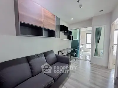 Modern living room with sleek furniture and open kitchen layout