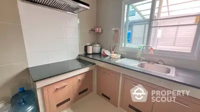 Modern kitchen with sleek countertops and ample storage in a bright, airy space.