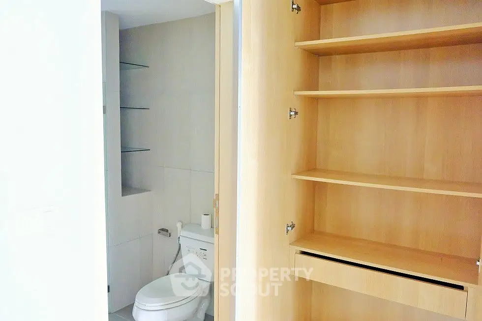 Modern storage space with sleek shelving and minimalist design.