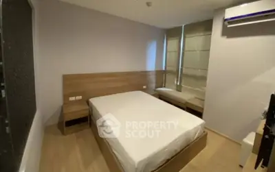 Modern minimalist bedroom with wooden furniture and air conditioning