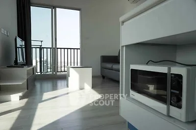 Modern living room with balcony view and sleek interior design